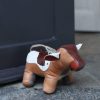 Owen Barry Doorstops & Draught Busters | Multi Patch Leather Cow Doorstop